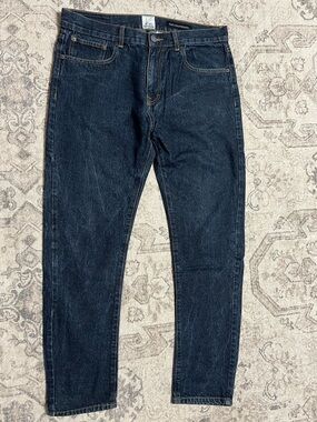 Of All Threads "The Engineered" slim-fit jeans—dark denim wash